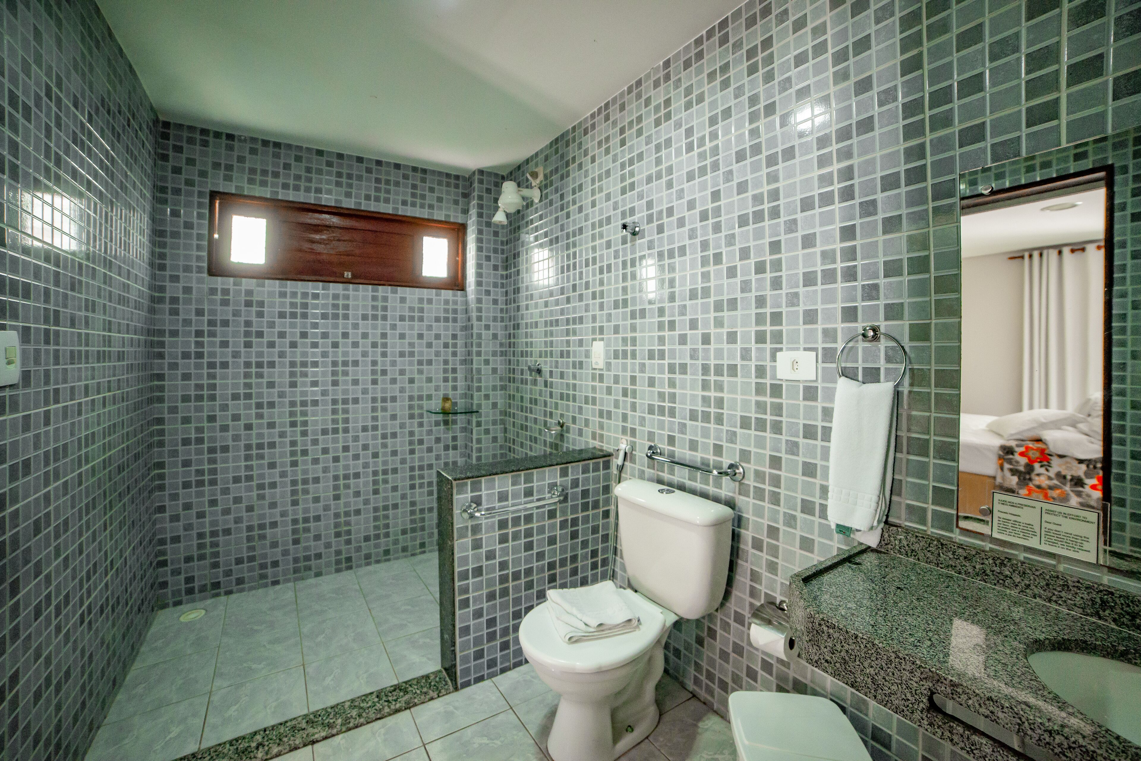 deluxe room | bathroom | shower, towels