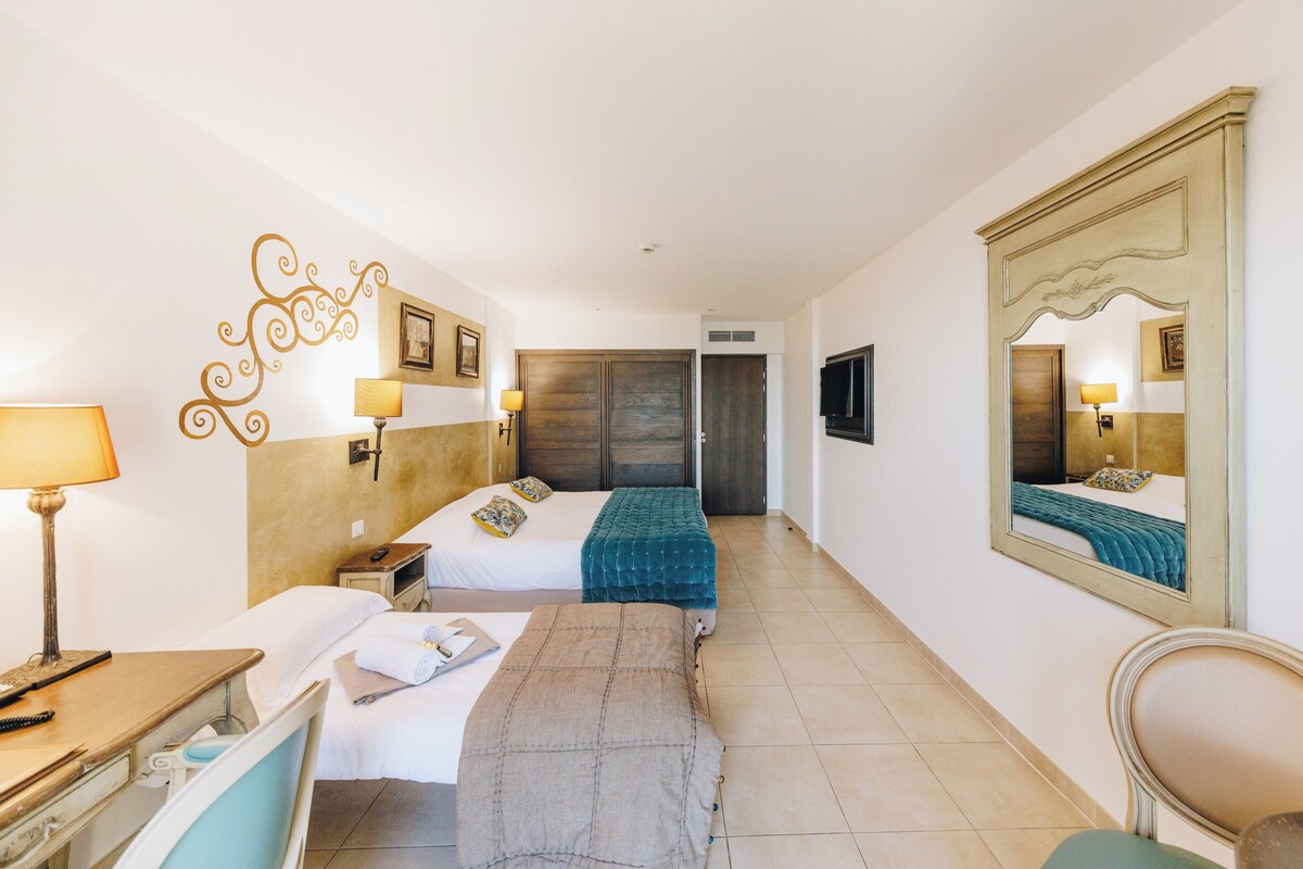 Family Triple Room, Sea View | Premium bedding, minibar, in-room safe, desk