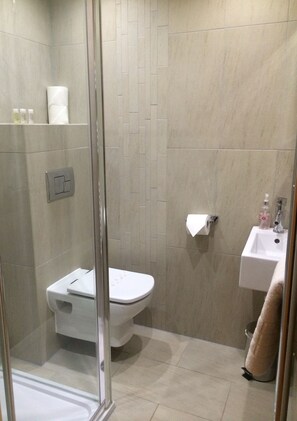 Shower, free toiletries, hair dryer, towels