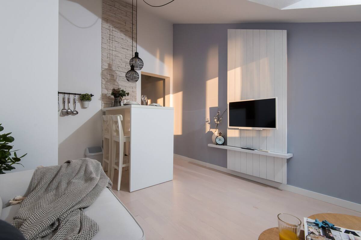 design apartment, 1 bedroom, sea view (top floor) | living area | flat-screen tv