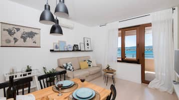 Exclusive Apartment, 1 Bedroom, Sea View | Living area | Flat-screen TV