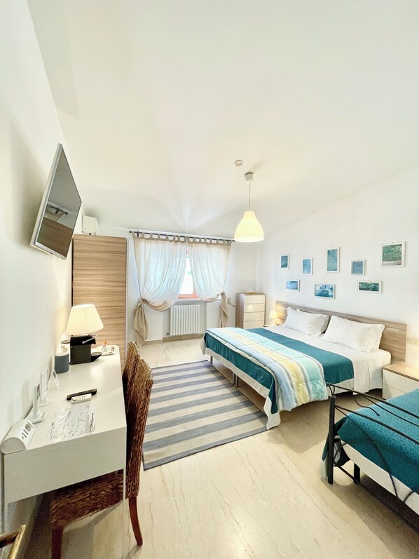 Triple Room, Non Smoking, Private Bathroom | Down comforters, pillowtop beds, minibar, individually decorated
