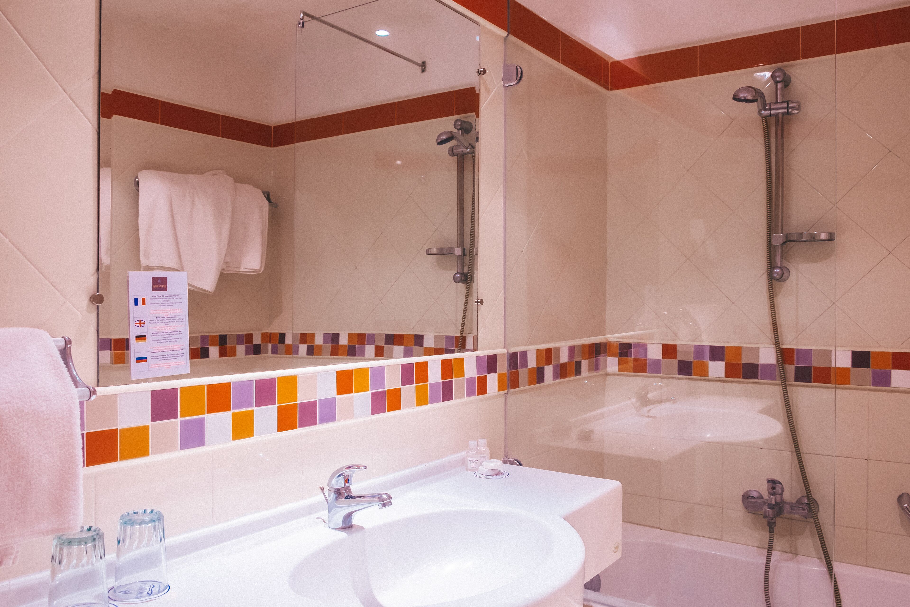 separate bathtub and shower, hair dryer, towels, soap