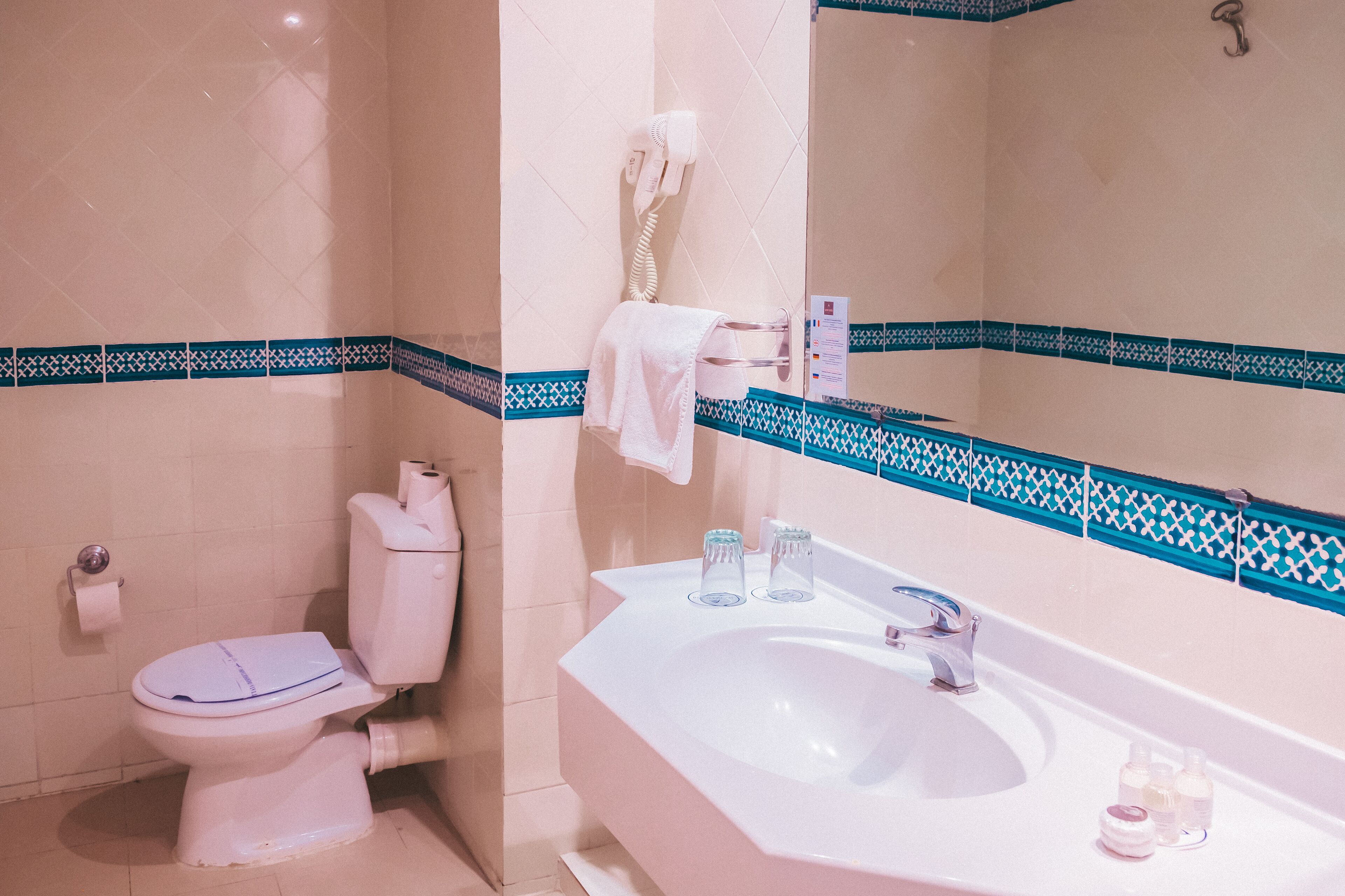 separate bathtub and shower, hair dryer, towels, soap