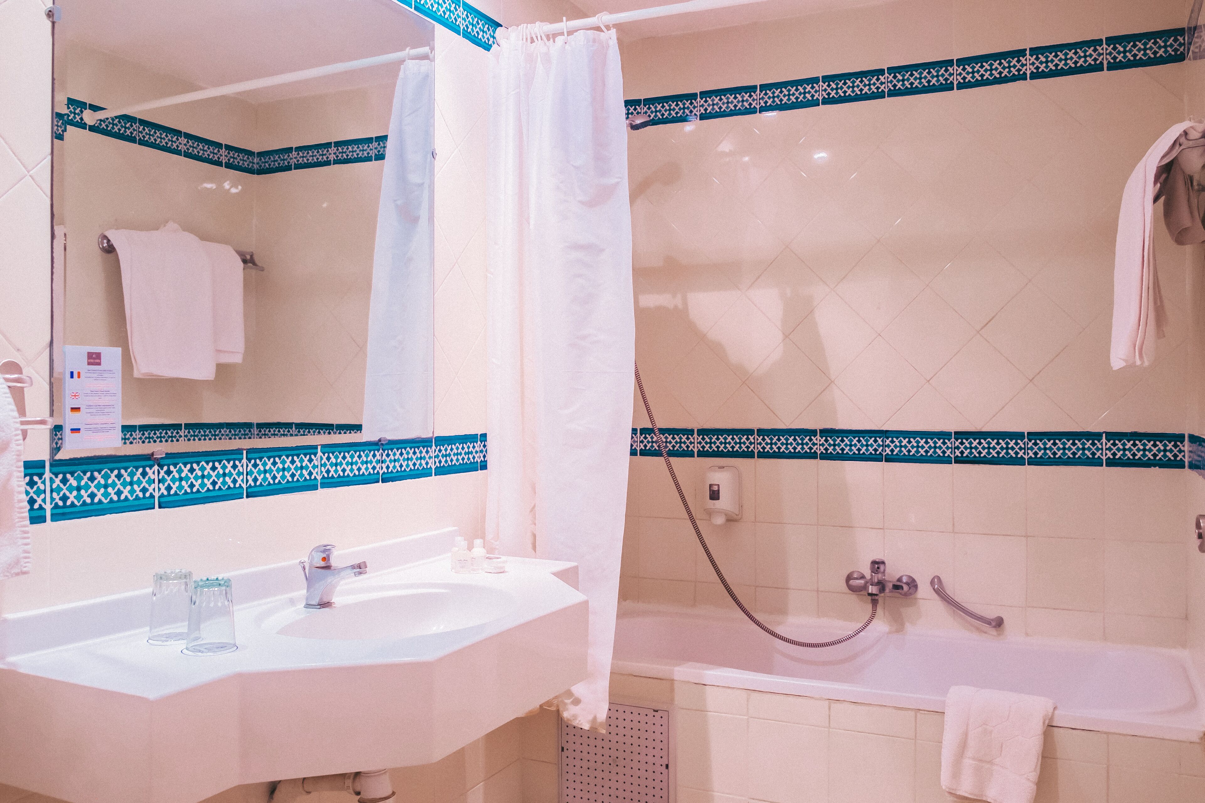 separate bathtub and shower, hair dryer, towels, soap