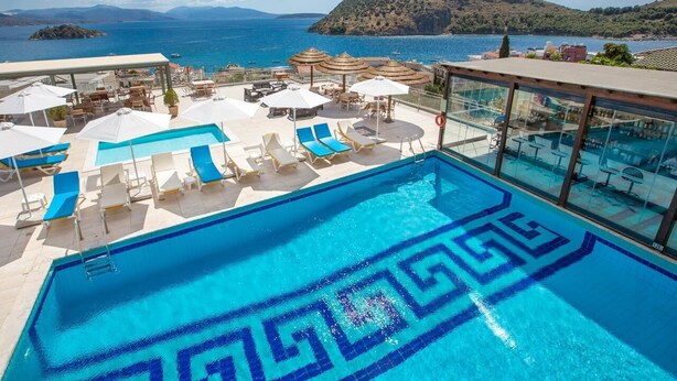 A rooftop pool with a view of the sea and a mountain. - John & George (Nafplio)