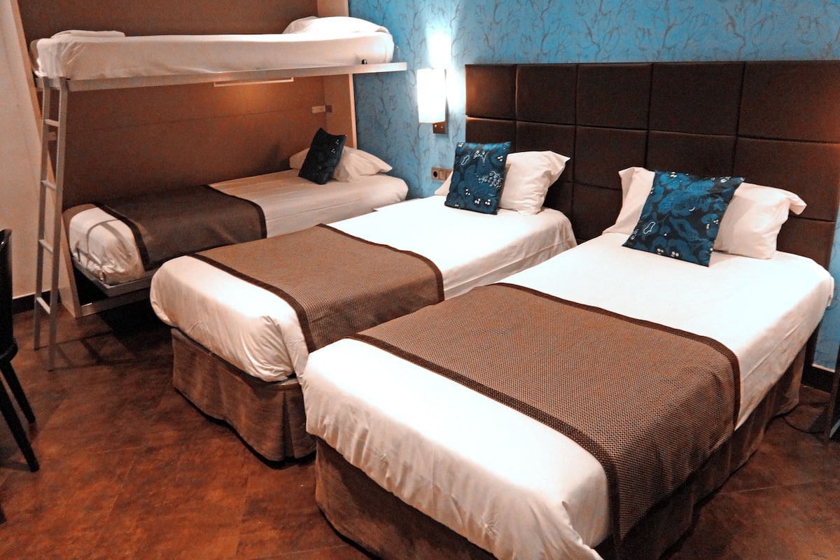Quadruple Room | In-room safe, individually decorated, individually furnished, desk