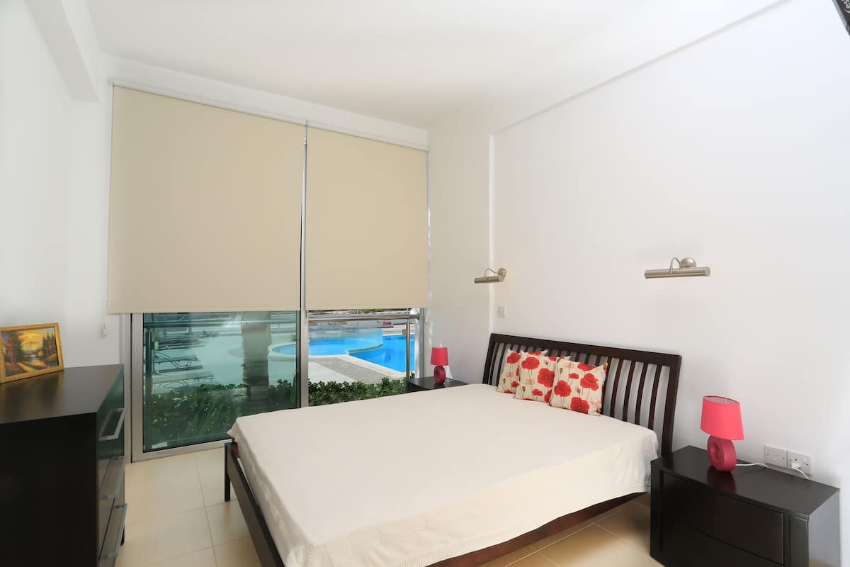Apartment, 1 Bedroom, Pool View | In-room safe, free cots/infant beds, free WiFi, bed sheets