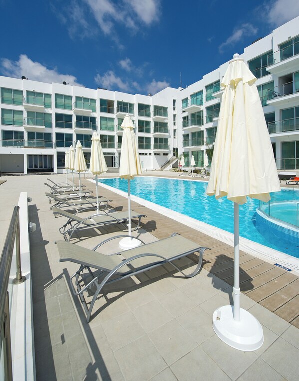 2 outdoor pools, pool umbrellas, pool loungers