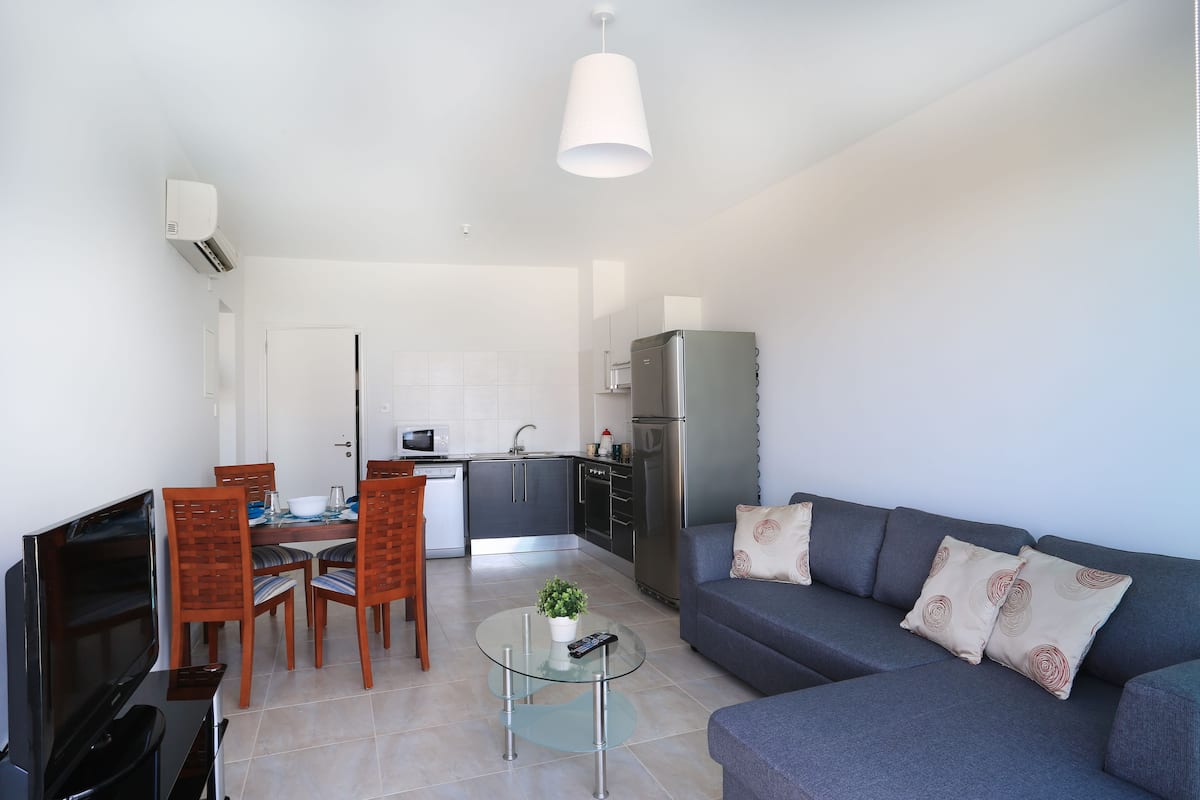 Apartment, 1 Bedroom, Sea View | Living area | 32-inch plasma TV with cable channels, TV