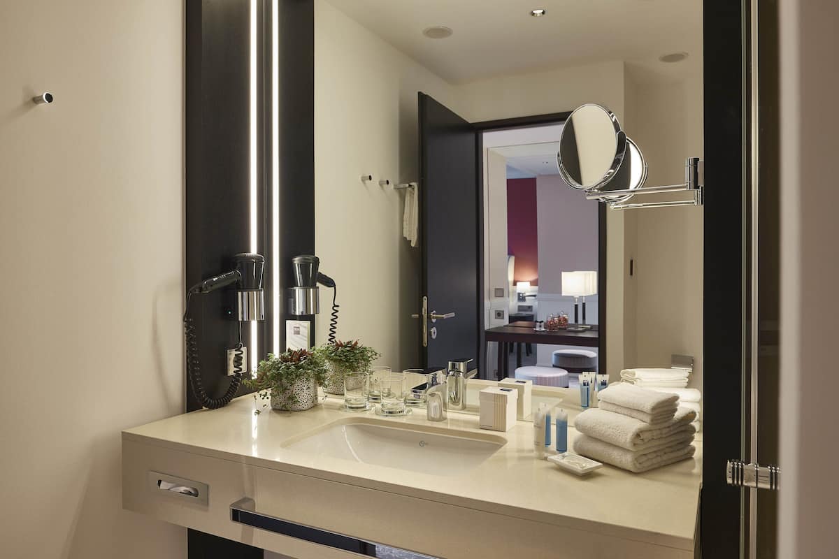 deluxe suite | bathroom | free toiletries, hair dryer, towels, soap