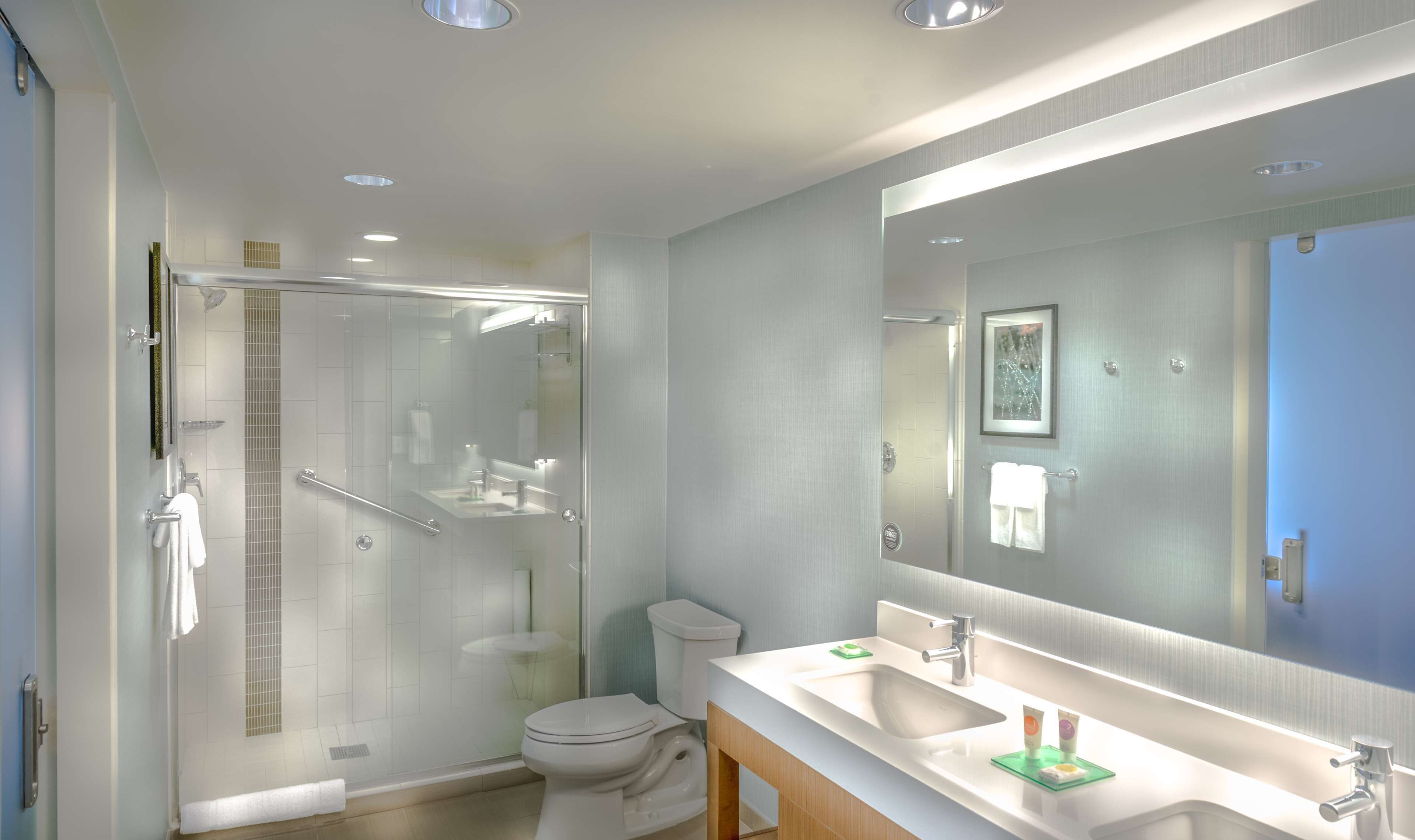 designer toiletries, hair dryer, towels