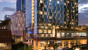 A modern hotel building with a prominent 'hotel INDIGO' sign. - Hotel Indigo Los Angeles Downtown by IHG (Los Angeles)