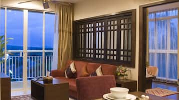 Apartment, 2 Bedrooms | Living area | 32-inch LCD TV with cable channels, TV, DVD player