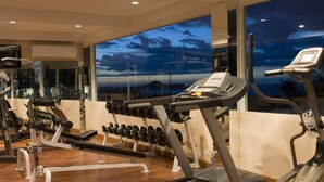 A gym with treadmills, dumbbells, and weight machines. - Arisara Place (Koh Samui)