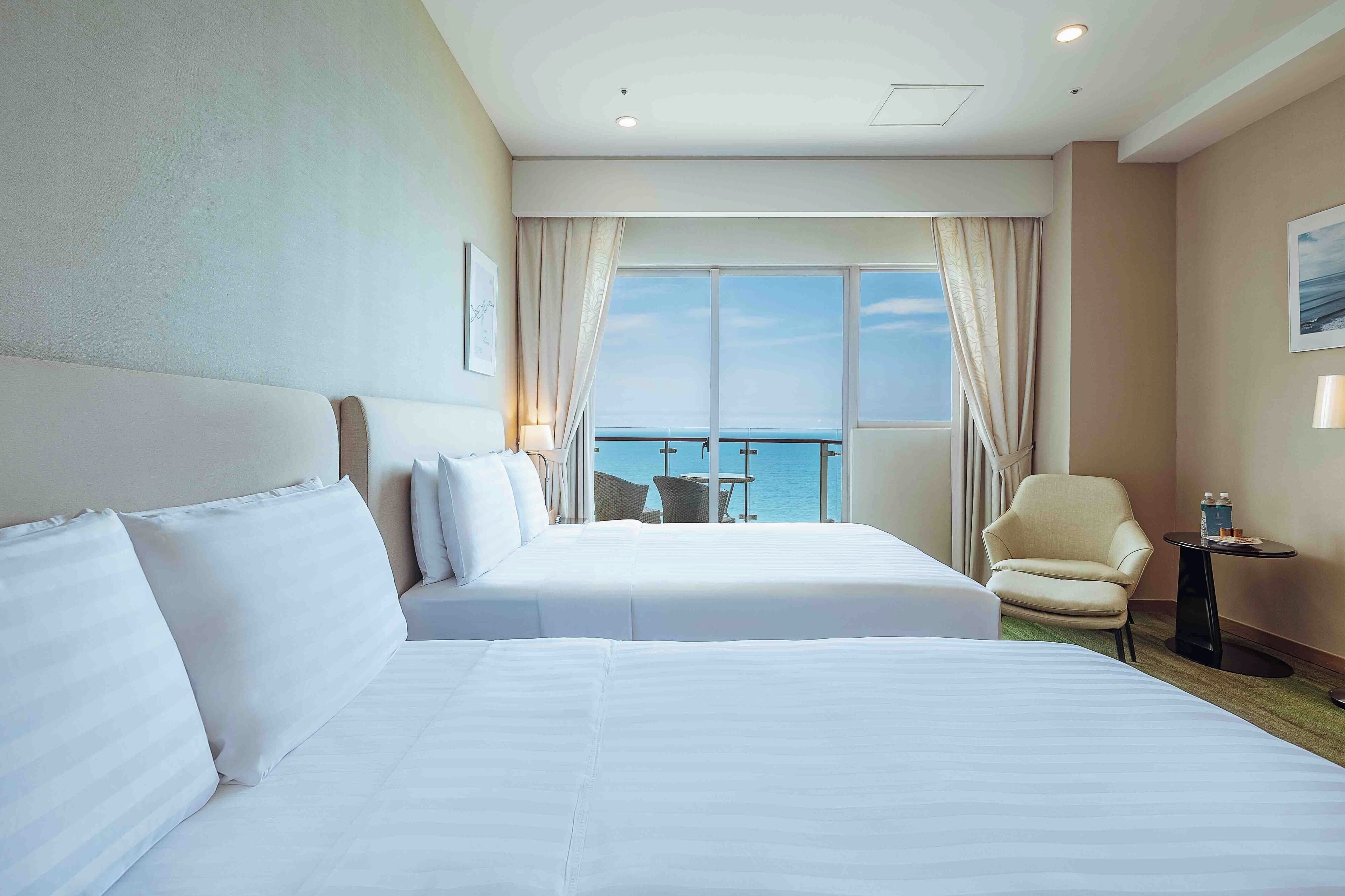 deluxe quadruple room | premium bedding, minibar, in-room safe, blackout curtains