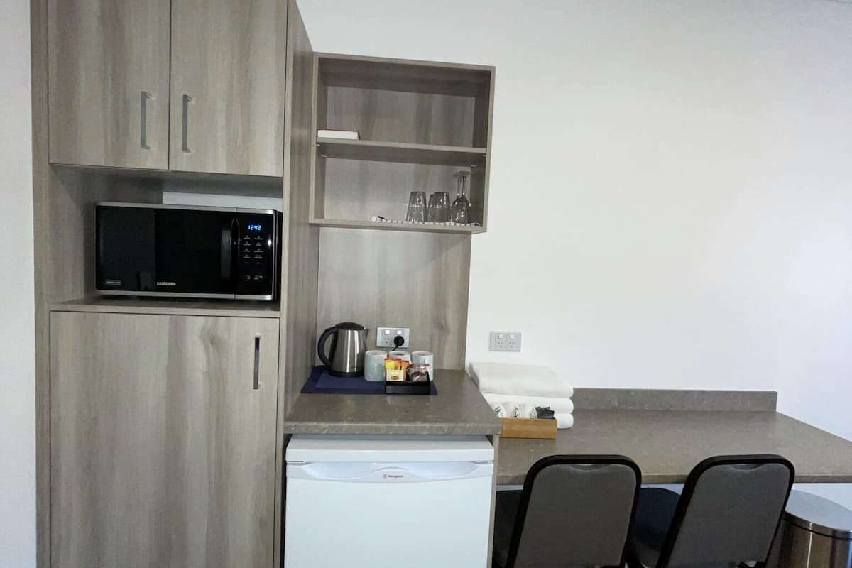 premium bedding, desk, laptop workspace, blackout curtains