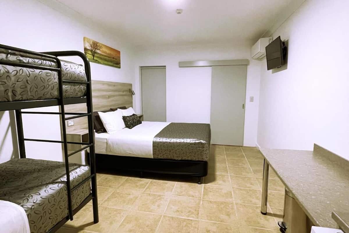 premium bedding, desk, laptop workspace, blackout curtains