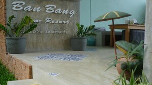 A reception area with a sign reading "Ban Bang Home Resort" and a tiled floor. - Ban Bang Home Resort (Phetchaburi)