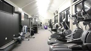 A gym with treadmills, stationary bikes, and weight machines. - Cherratta Lodge (Karratha Industrial Estate)