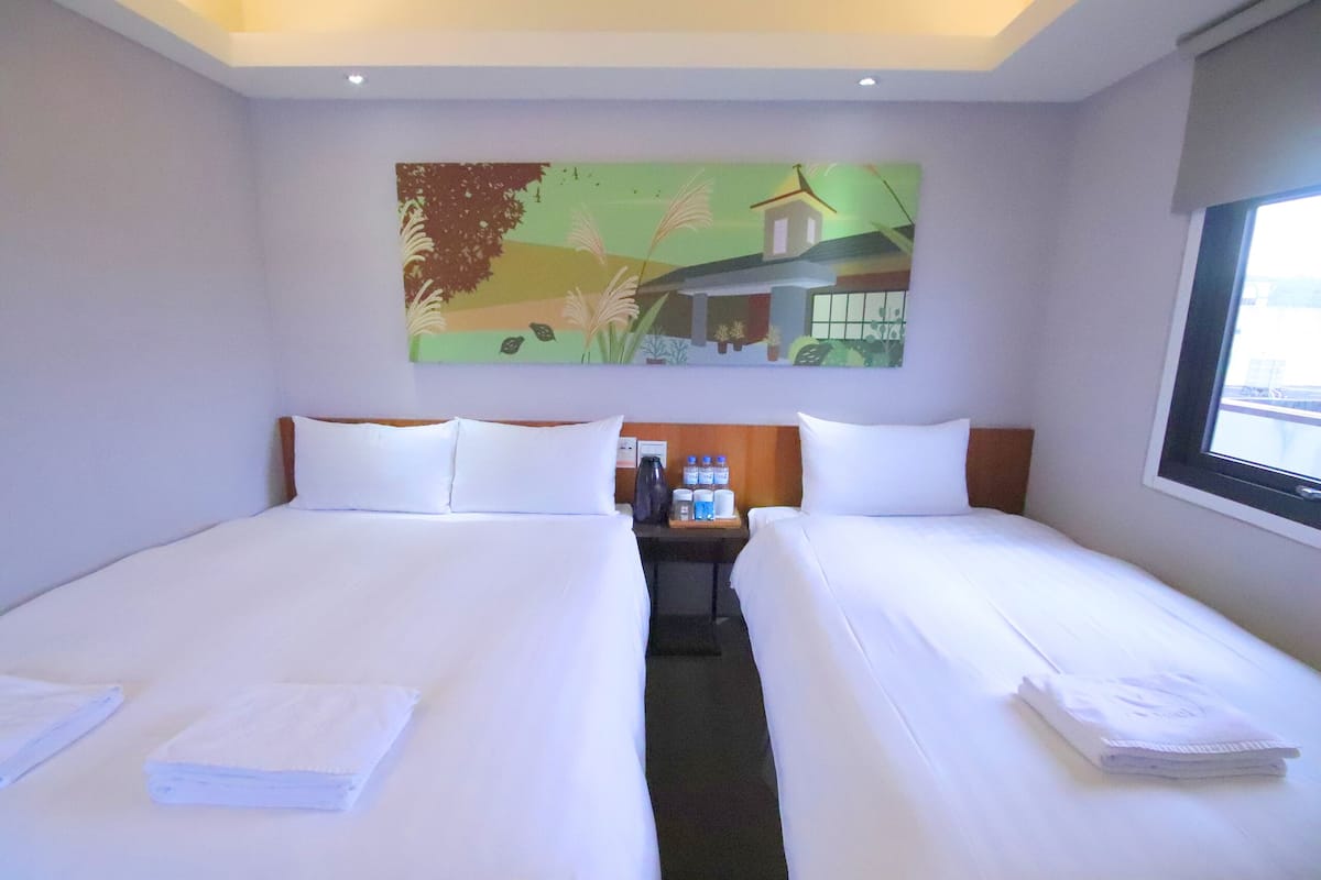 comfort triple room | premium bedding, desk, blackout curtains, soundproofing
