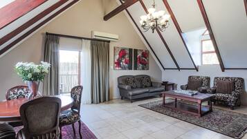 Penthouse | Living area | Flat-screen TV