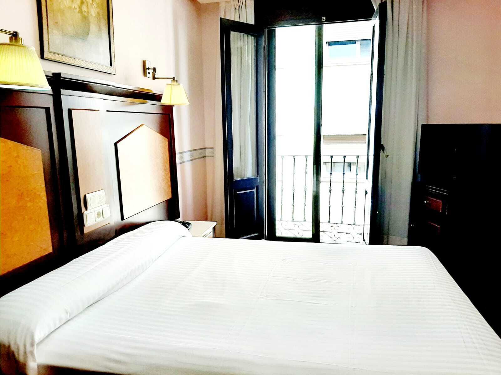 Double Room | Down comforters, desk, blackout drapes, free cribs/infant beds