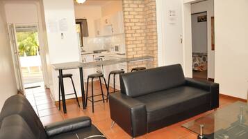 Apartment 22 - Four Sleeper Garden View | Living room | 42-inch flat-screen TV with cable channels, TV