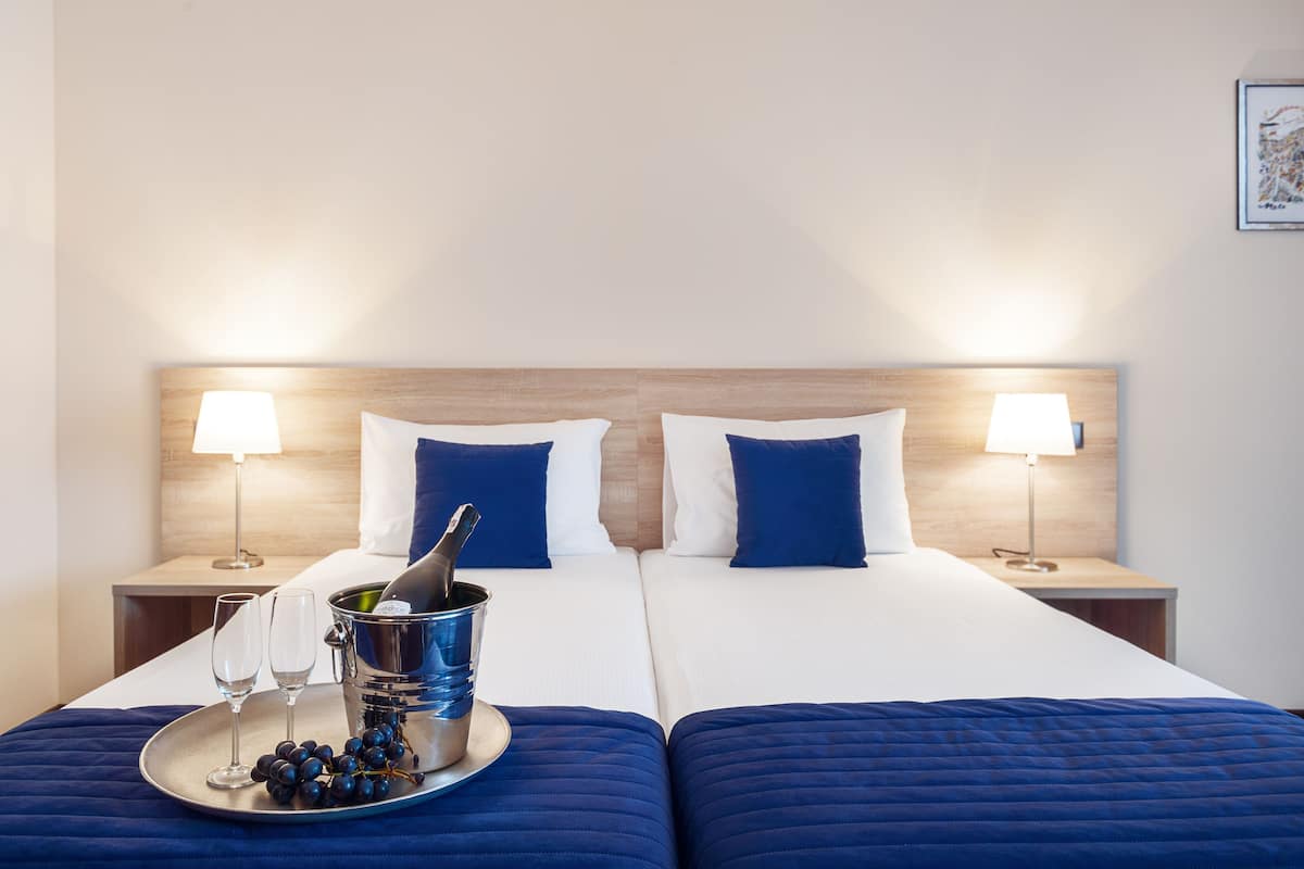 premium bedding, down duvets, minibar, in-room safe