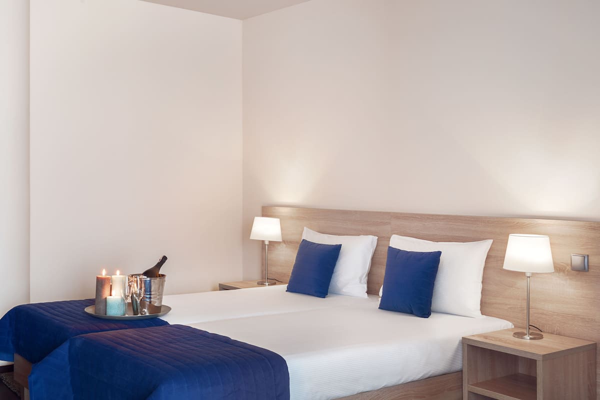 premium bedding, down duvets, minibar, in-room safe