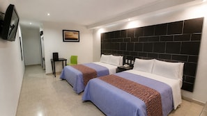 A hotel room with two beds, a flat-screen TV, a desk, and a chair. - First Inn Hotel & Business (Texcoco de Mora)