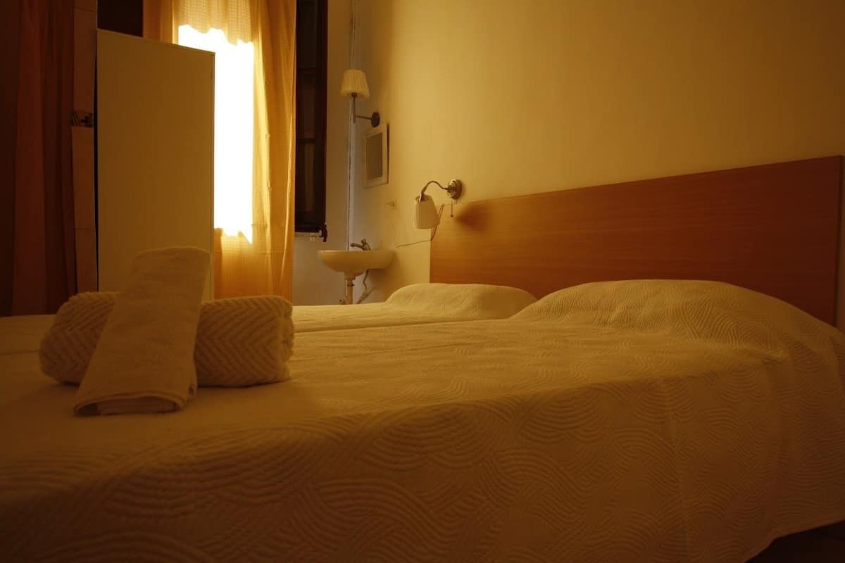 Blackout drapes, WiFi (free), bed sheets