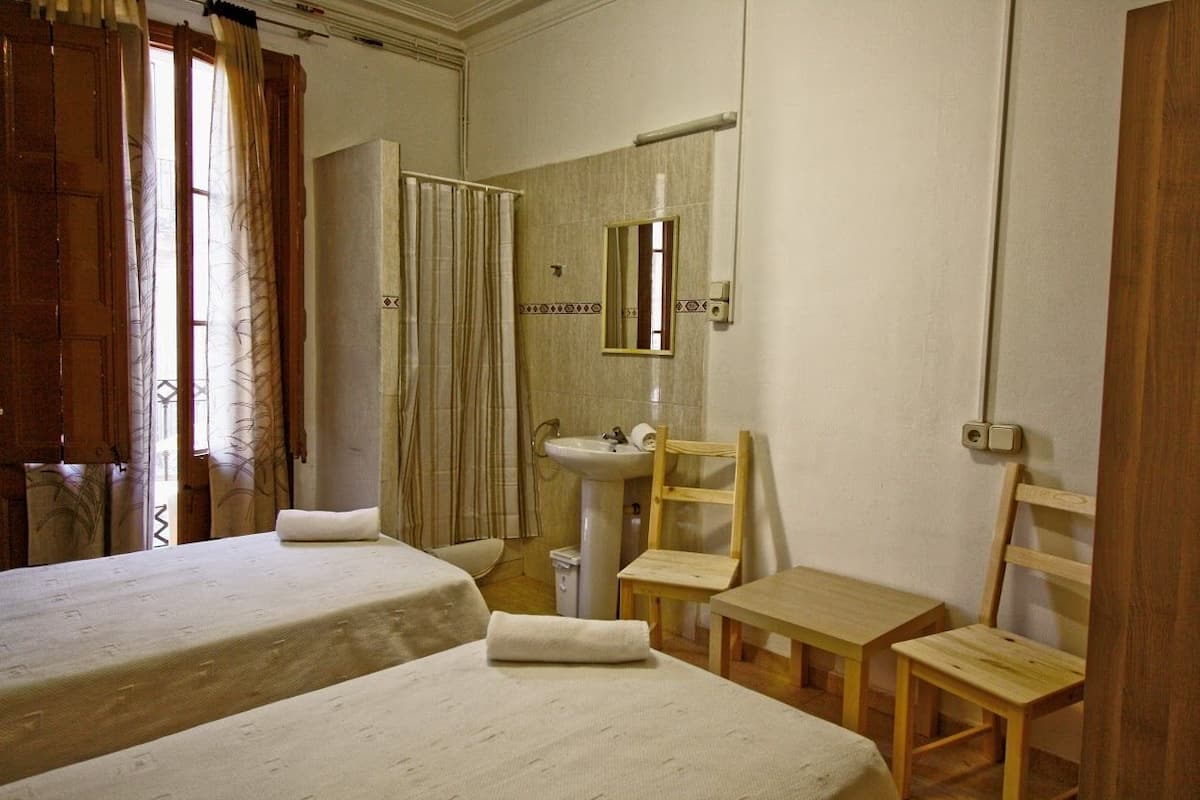 Blackout drapes, WiFi (free), bed sheets