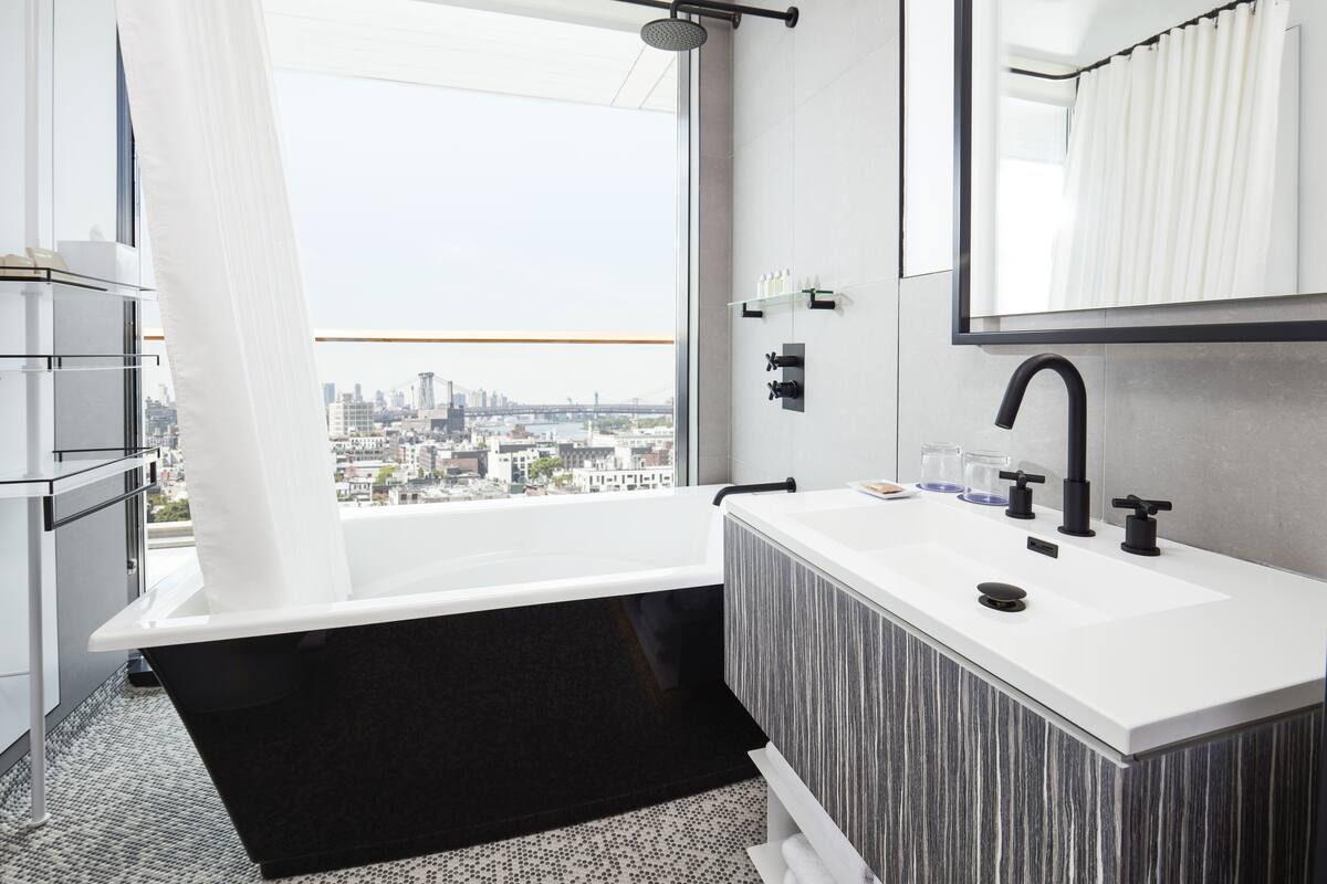suite, 1 queen bed, balcony, corner (gotham) | bathroom | designer toiletries, hair dryer, bathrobes, towels