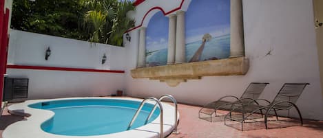 Outdoor pool, open 9:00 AM to 9:00 PM, sun loungers