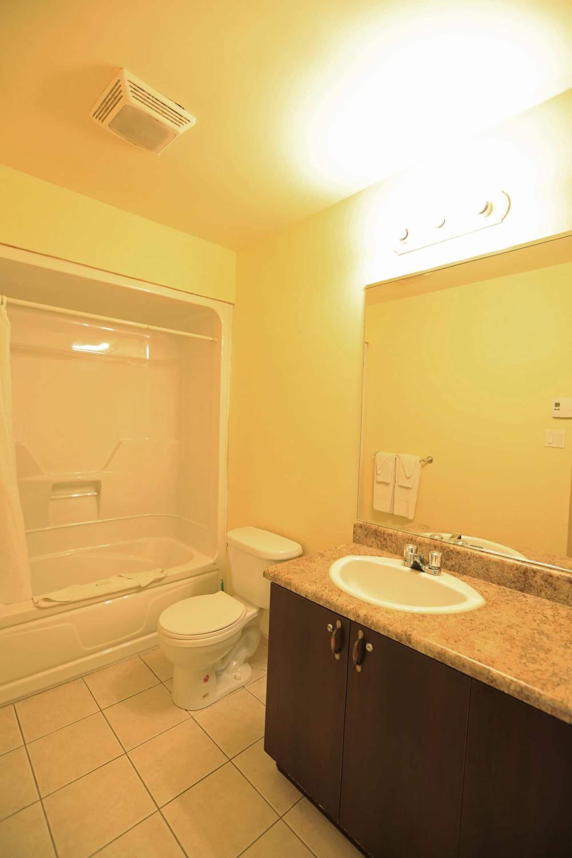 standard room, 2 queen beds (hotel) | bathroom | free toiletries, hair dryer, towels