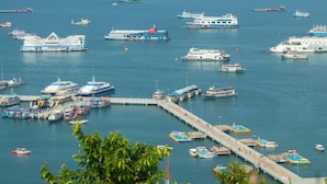 A harbor with multiple boats and a pier. - VC. Pattaya (Pattaya)