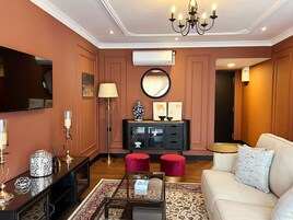 Royal Suite, 1 King Bed | Living area | 20-inch LCD TV with satellite channels, TV