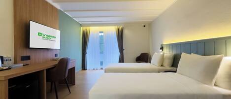 Chambre, 2 lits jumeaux, balcon, vue sur le jardin | Coffre-fort, bureau, espace de travail pour ordinateurs portables
