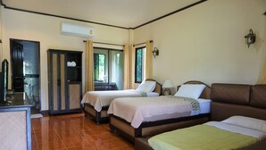 A hotel room with two single beds, a sofa bed, a desk with a chair, and a wardrobe. - Ban Rai Tin Thai Ngarm Eco Lodge (Mae Rim)