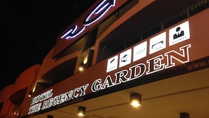 A hotel sign with "HOTEL THE REGENCY GARDEN" and various amenities icons like CCTV, WiFi, and security. - The Regency Garden Hotel (Ipoh)