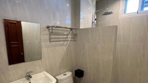 A modern bathroom with a sink, toilet, and shower. - Prince (Chiang Mai)