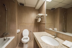 A bathroom with a toilet, sink, and shower. - Bangkok City Suite (Bangkok)
