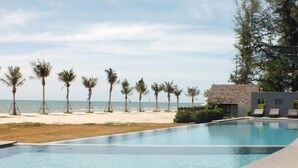 A swimming pool with a view of the beach and ocean. - Casuarina Beach Resort (Cha Am)