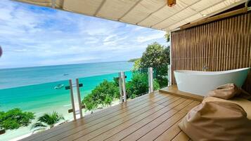 Habitación panorámica, 1 cama King size, vista al océano | Escritorio, cortinas blackout y ropa de cama