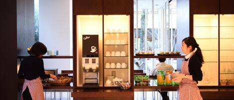 A cafe with a coffee machine, shelves with cups, and a counter with a drink dispenser.