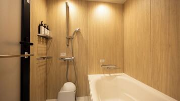 Combined shower/bathtub, hair dryer, slippers, towels