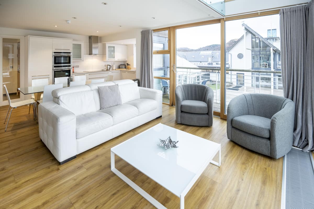 three-bedroom luxury apartment | living area | flat-screen tv