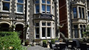 An Italian restaurant with stone facade and outdoor seating. - Elgano (Cardiff)