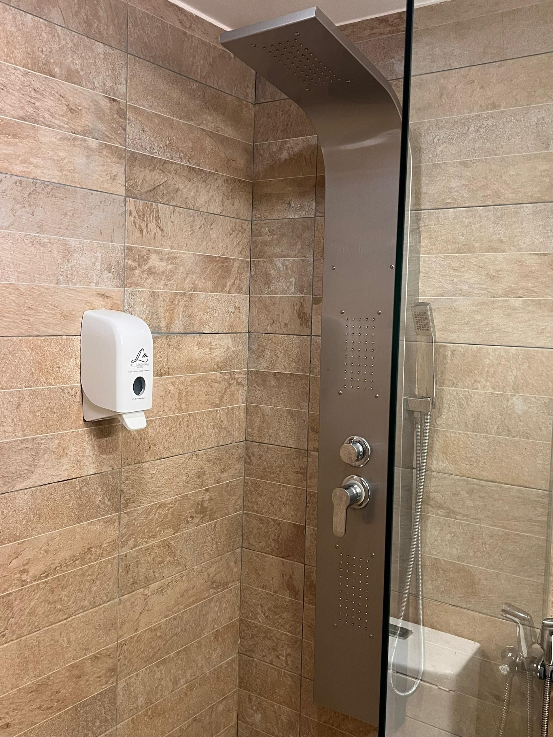 deluxe twin room | bathroom | shower, free toiletries, slippers, towels